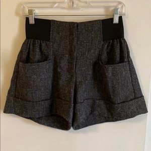 Grey high-wasted pleated shorts.